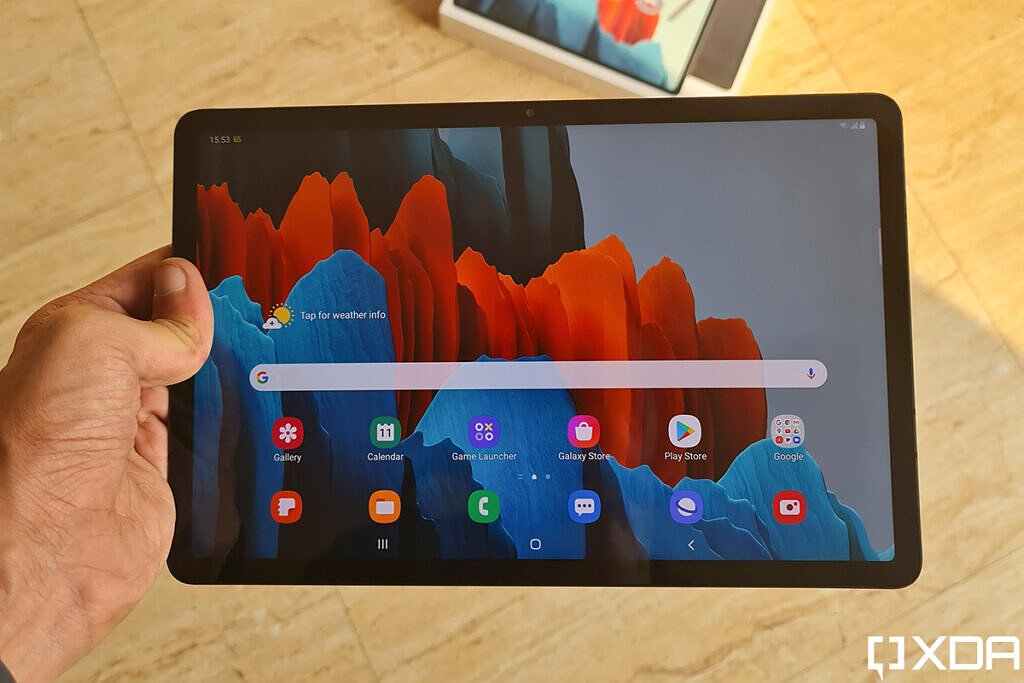 Samsung Galaxy Tab S7 display with front camera on the top edge and retail box in the background